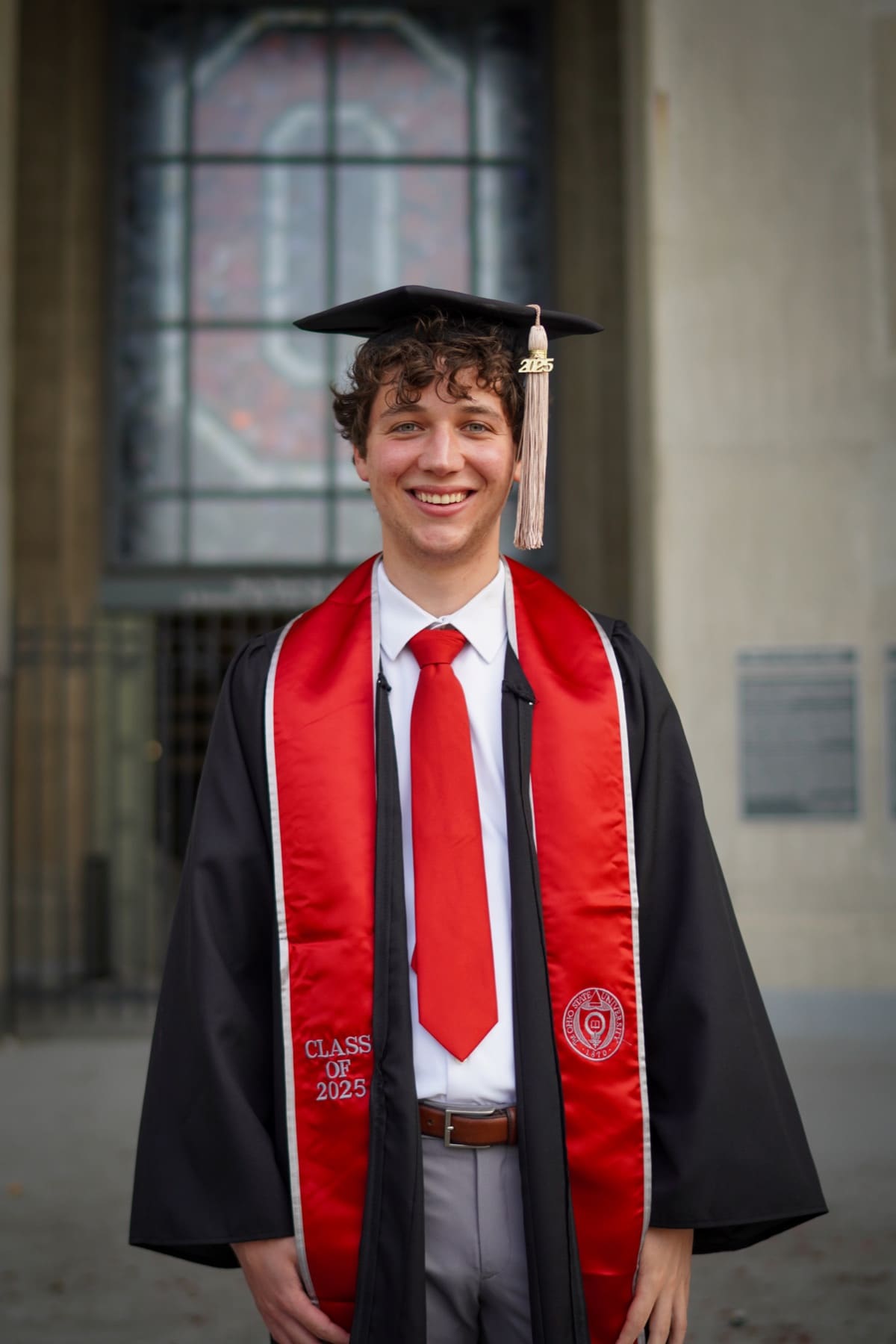 Alec Levine in his Ohio State graduation cap and gown, Class of 2025