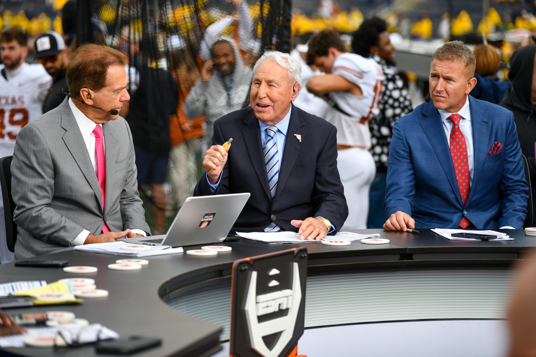 Nick Saban, Lee Corso, and Kirk Herbstreit seated at the College GameDay desk before Michigan played Texas