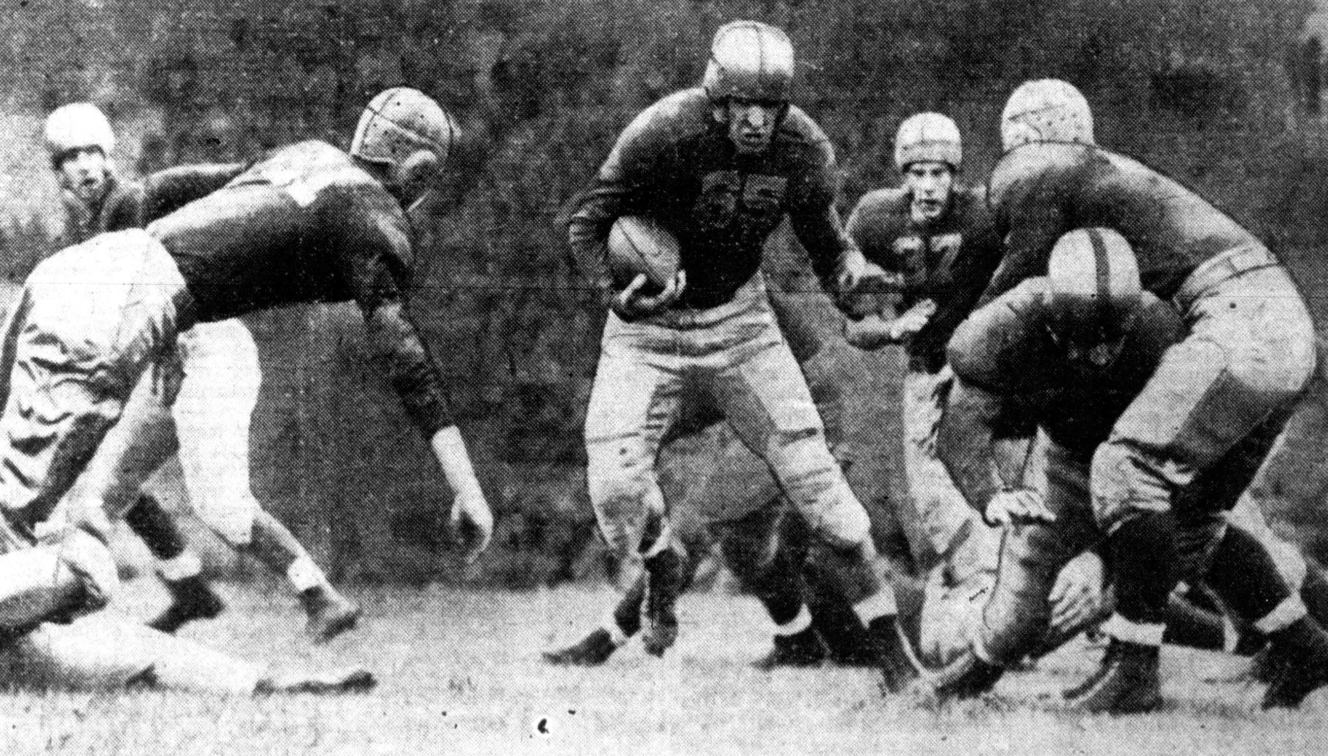 A historical college football play in progress